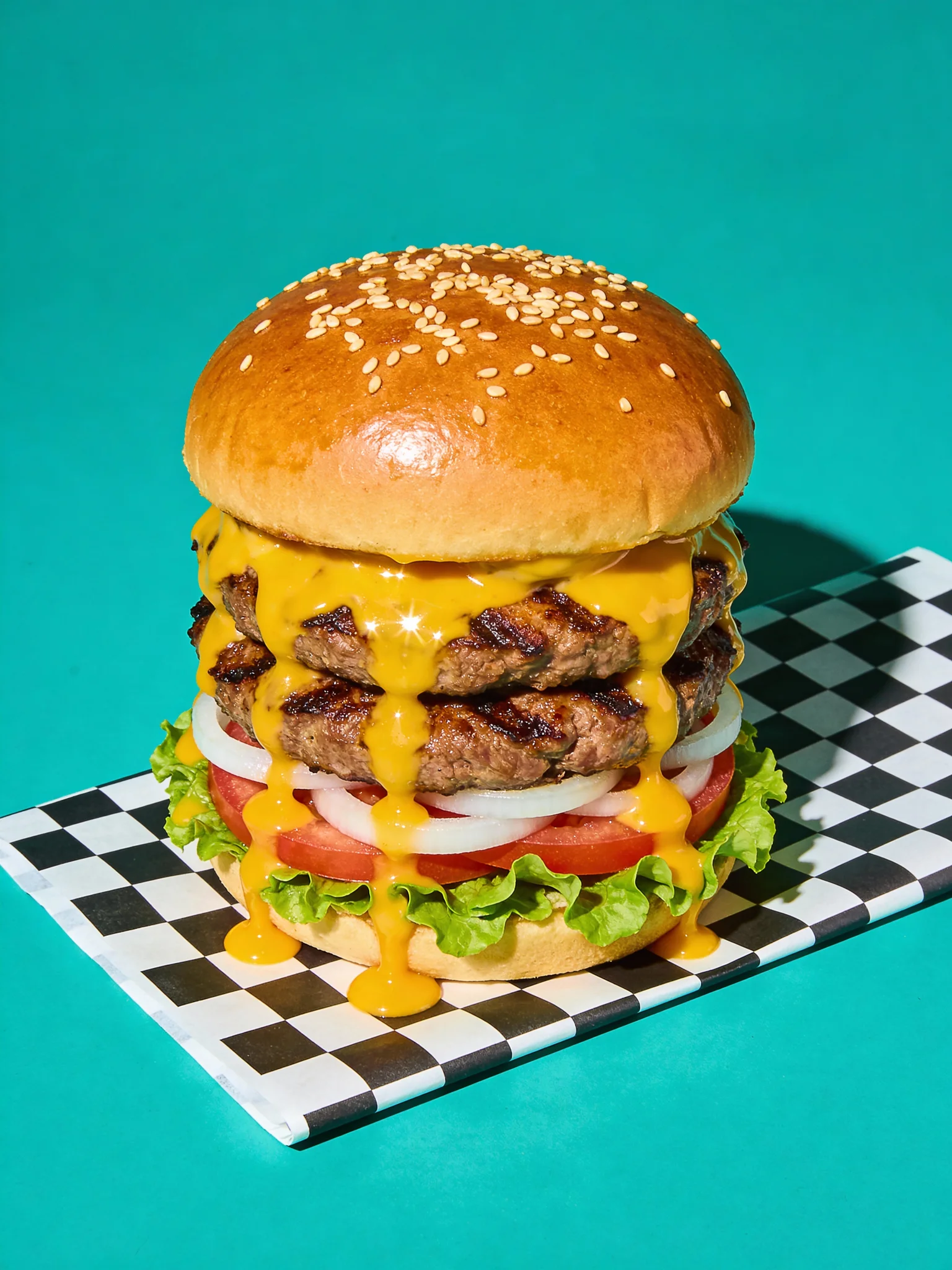 Hamburger on a checkered nylon on a blue background